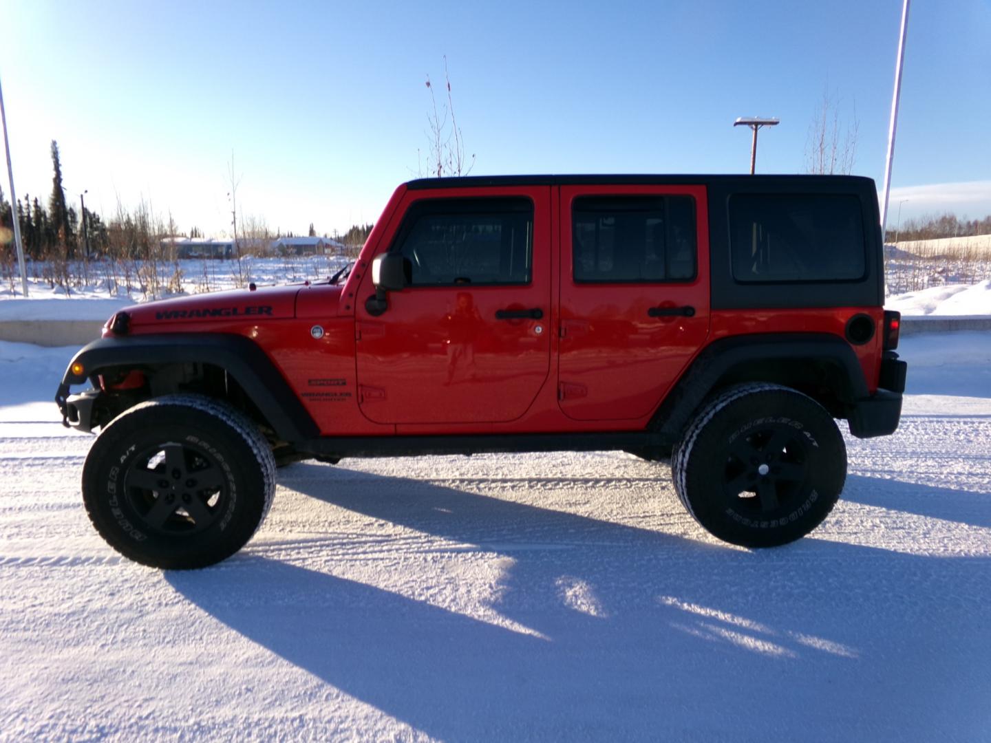 2017 Red Jeep Wrangler Unlimited Sport 4WD (1C4BJWDG9HL) with an 3.6L V6 DOHC 24V FFV engine, 6-Speed Manual transmission, located at 2630 Philips Field Rd., Fairbanks, AK, 99709, (907) 458-0593, 64.848068, -147.780609 - Photo#2